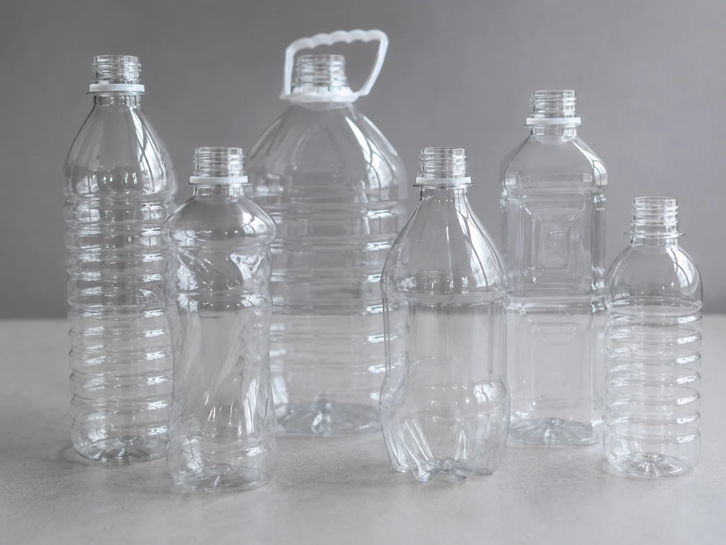 Various PET beverage bottle silhouettes and high-speed stretch blow molding production line overview